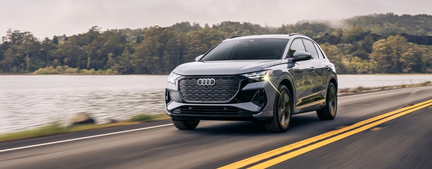 Grey 2024 Audi Q4 e-tron driving to a Audi dealer near Lexington